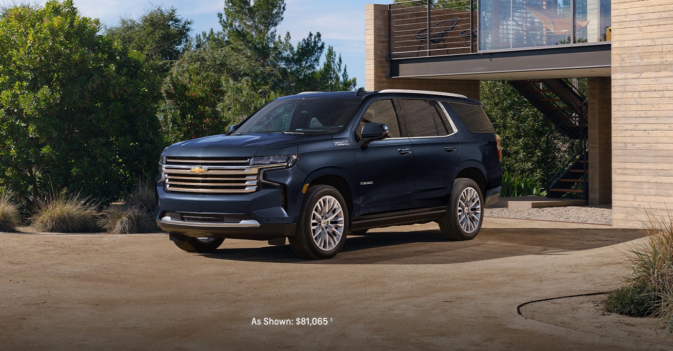 2024 Chevrolet Tahoe parked in front of a house