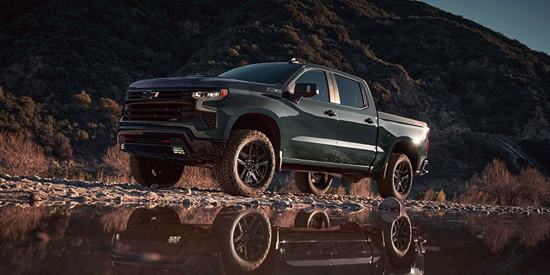 2025 Chevrolet Silverado 1500 driving over stream